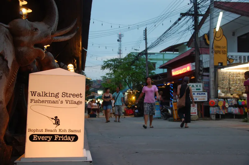 Walking Street sign for Fisherman's Village on Bophut Beach, Koh Samui, at dusk