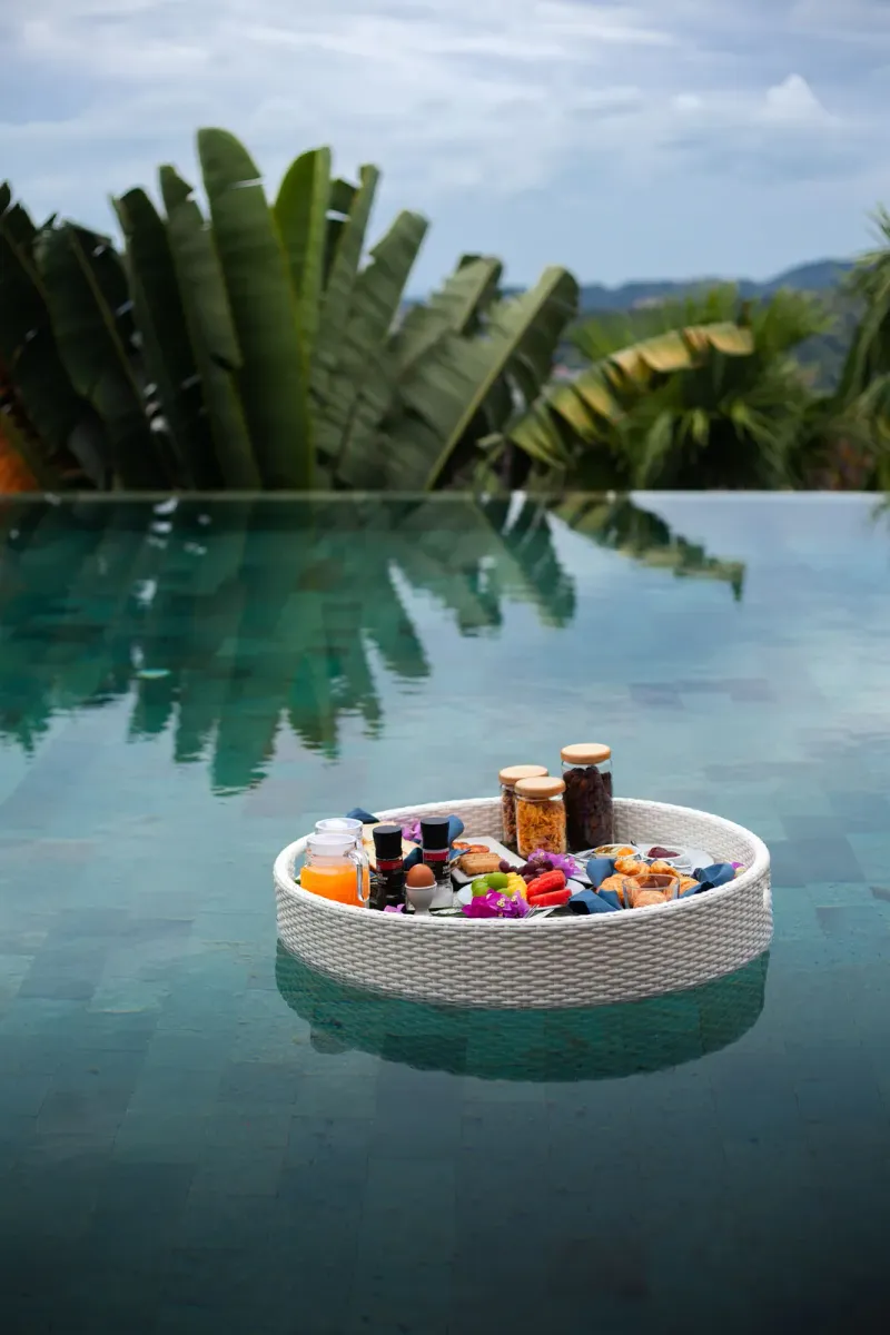 Floating breakfast tray in a private pool villa at Cape Fahn Hotel, Koh Samui