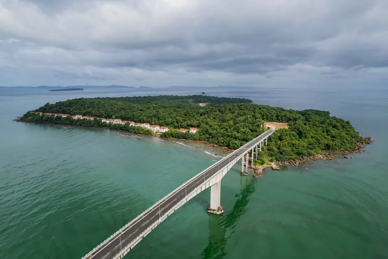 Aerial view of a tropical island bridge near Cape Fahn's private islet on Koh Samui