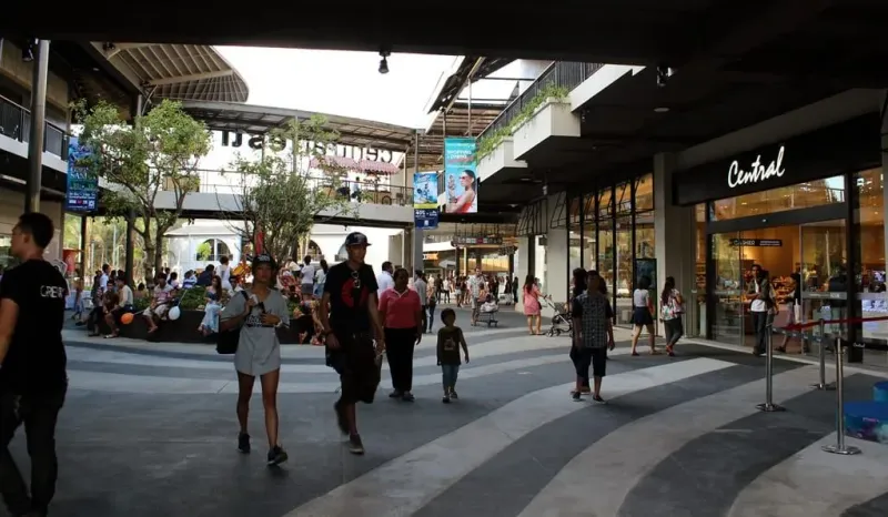 Shoppers walking past a Central department store entrance inside Central Samui mall, Koh Samui