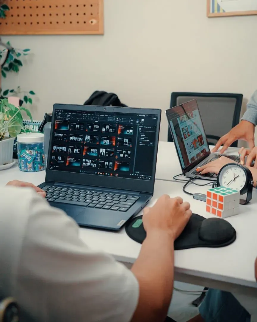 Laptop and coffee cup on a café table, a typical laptop-friendly workspace setup in Koh Samui