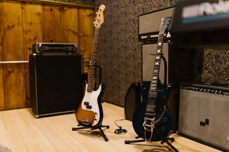 Electric guitars and amplifiers arranged in a music studio setting