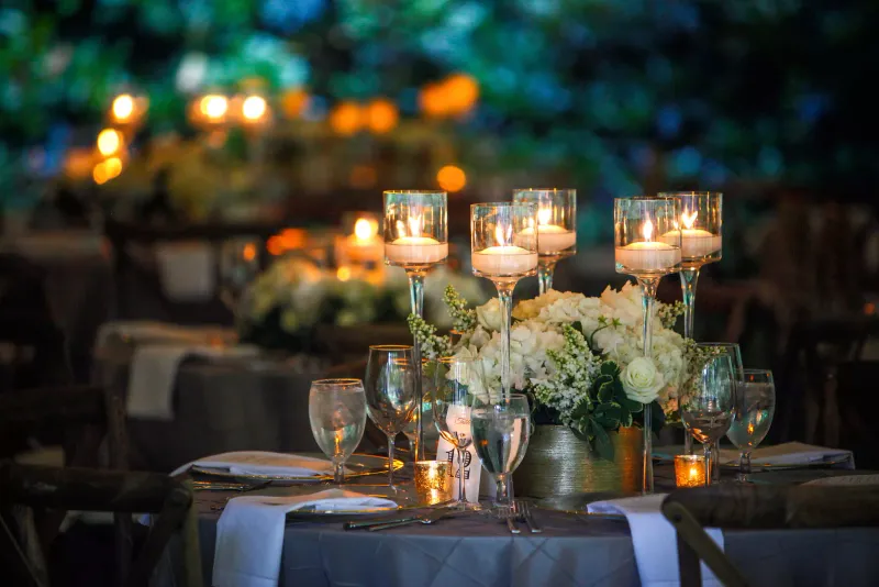 Candlelit table setting for an evening event at Kimpton Kitalay Samui, Choeng Mon Beach, Koh Samui