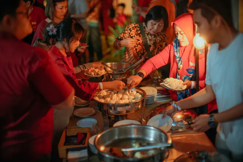 Guests helping themselves at a festive buffet