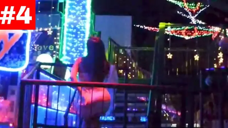 A performer works the crowd from the stage at Green Mango Club