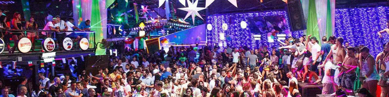 Packed dance floor and stage lighting inside Green Mango Club, Chaweng, Koh Samui
