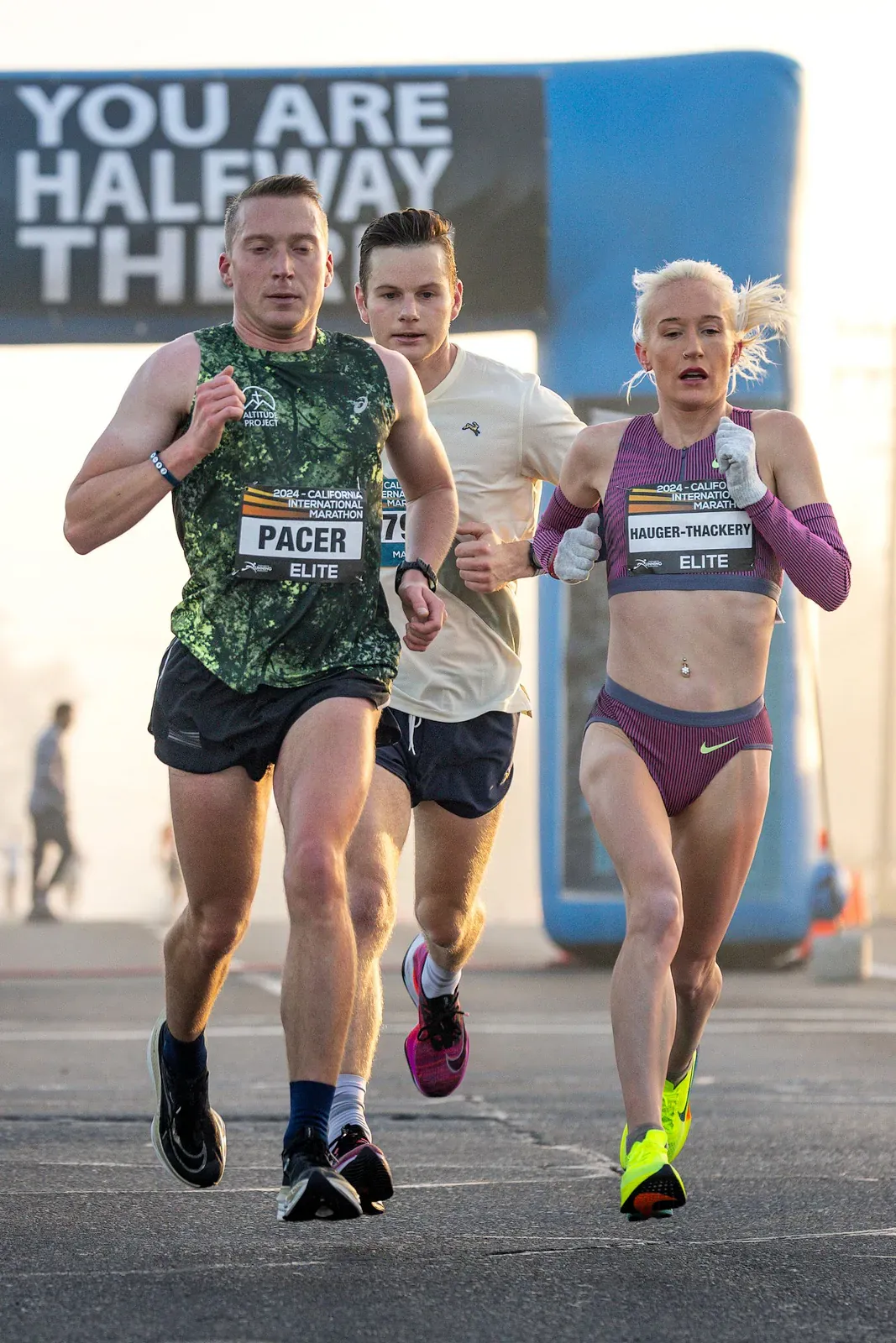 Two runners side by side in a road race