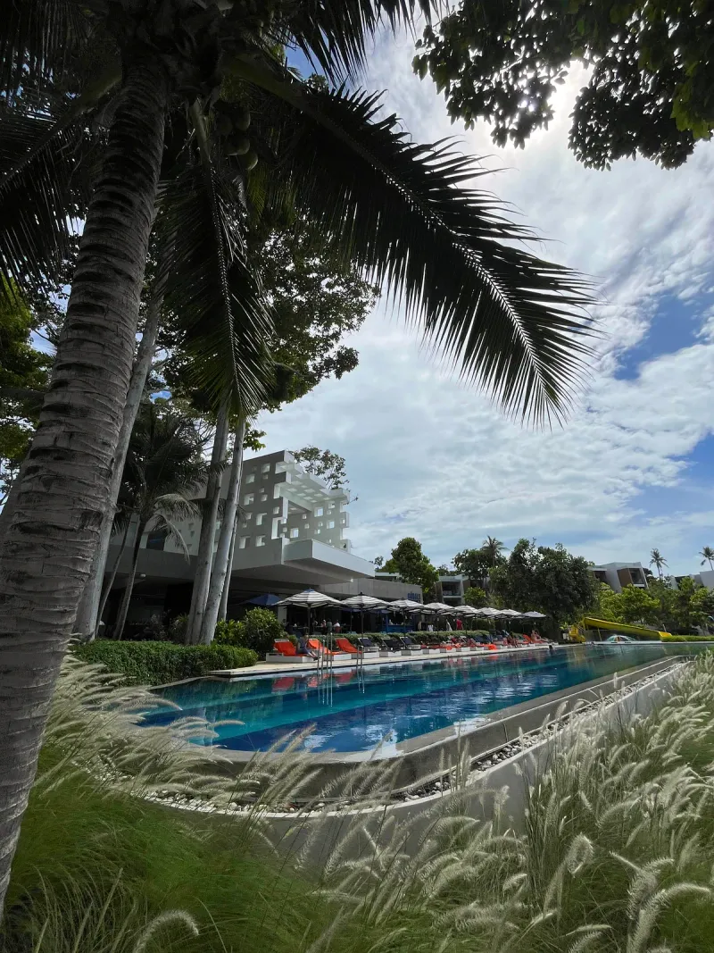 Family pool with yellow waterslide at Hyatt Regency Koh Samui, North Chaweng