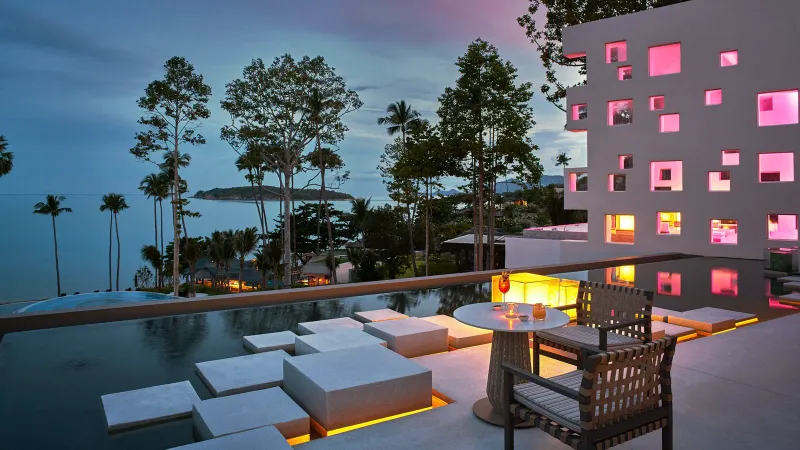 Cascading swimming pools and kids' splash pool with slide at Hyatt Regency Koh Samui
