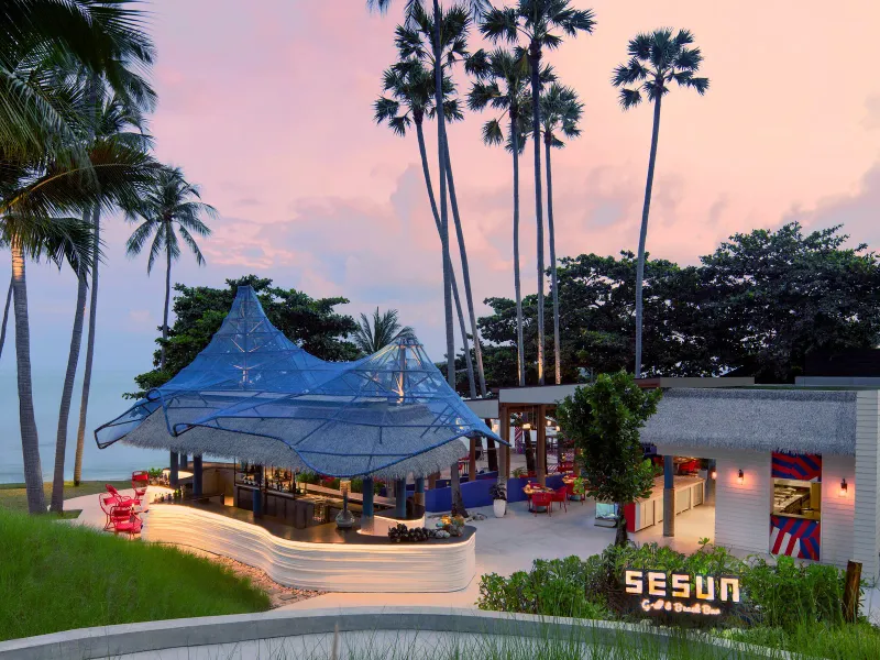 Aerial view of the cascading pools and kids' pool with slide at Hyatt Regency Koh Samui