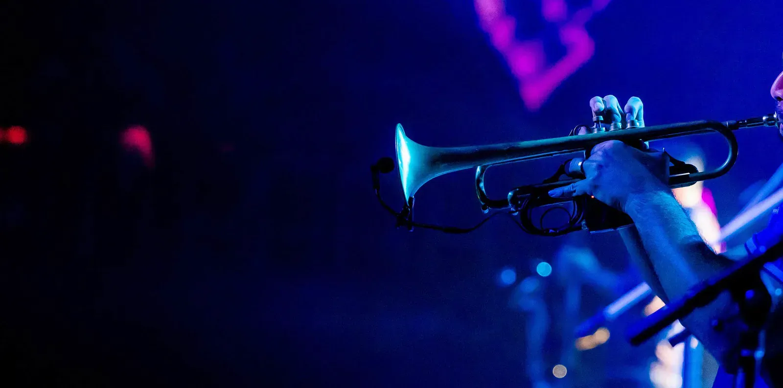 Trumpet player in blue stage light