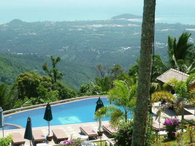 A hillside pool view over Koh Samui's forested interior near Lipa Noi, illustrative of the sweeping views from the island's high ground