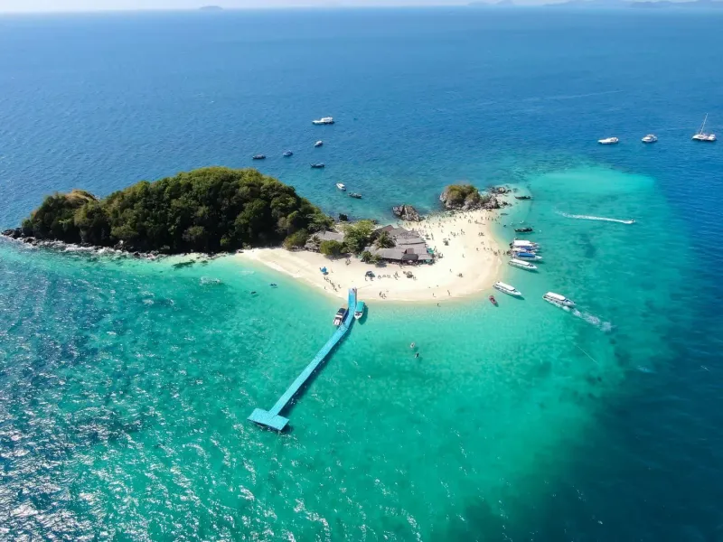 Aerial view of small turquoise-water island near Phuket popular for day trips