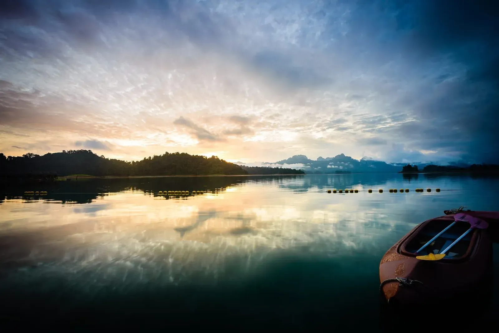 Sunrise over Cheow Lan Lake seen from a ranger station in Khao Sok National Park