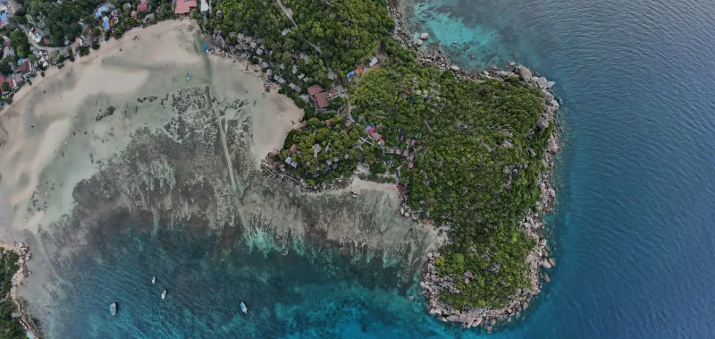 Aerial shot of Koh Tao's peninsula and turquoise waters seen on the Koh Samui speedboat tour