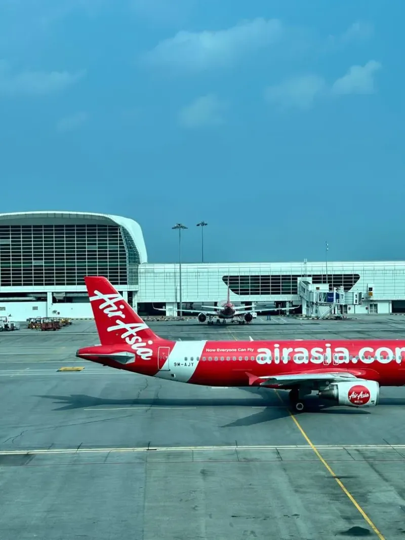 Regional airliner taxiing at a modern terminal serving Koh Samui arrivals