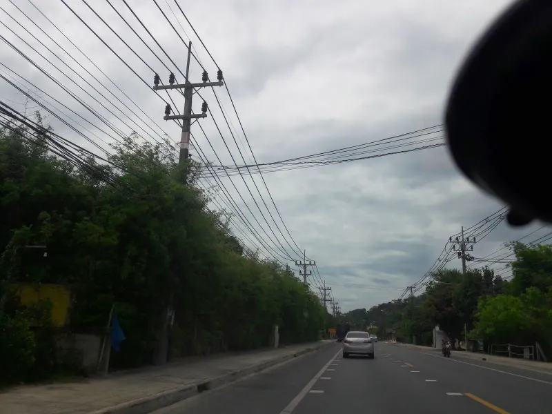 Palm-lined road leading toward Bang Po Seafood on Koh Samui's north coast