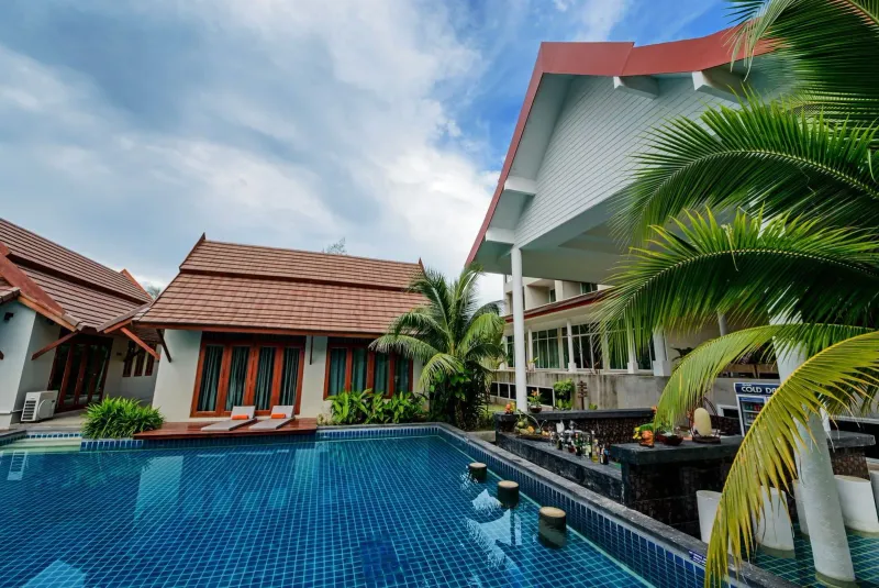 Serene resort pool with modern villa architecture on Koh Samui