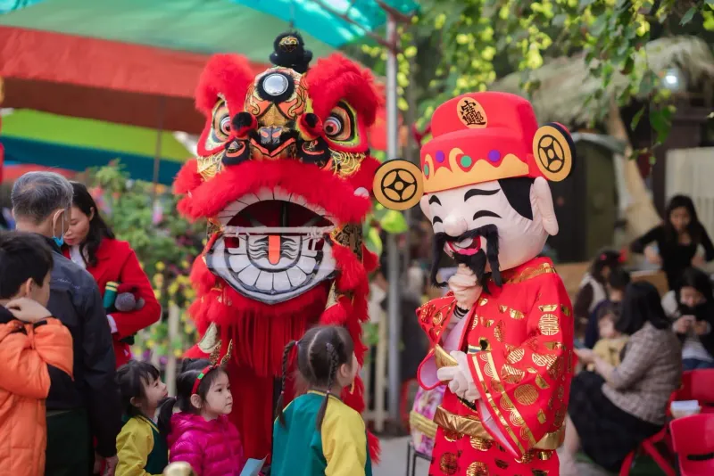 Children in traditional costumes at a Chinese New Year celebration parade