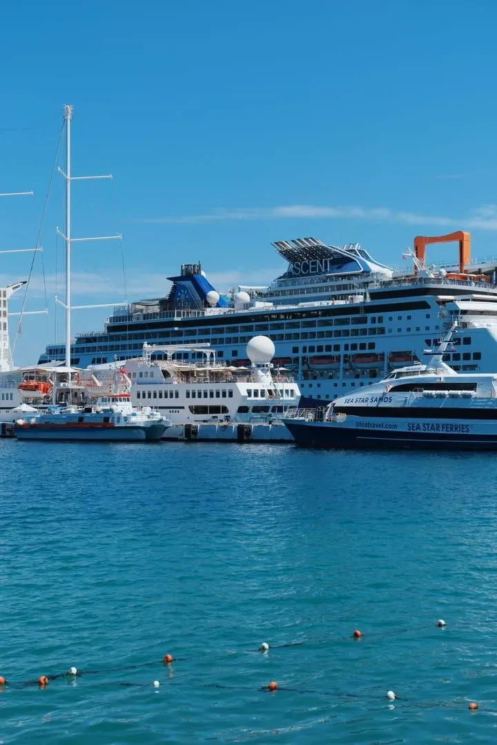 Vibrant cruise ship docked at a sunny port, representative of ships that call at Koh Samui