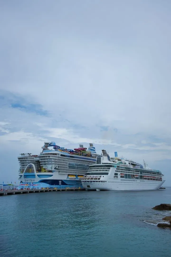 Two large cruise ships at anchor, illustrating a typical Gulf of Thailand cruise call like Koh Samui