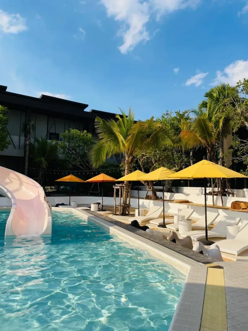 Sunny poolside loungers at a Koh Samui resort suited to a family beach holiday