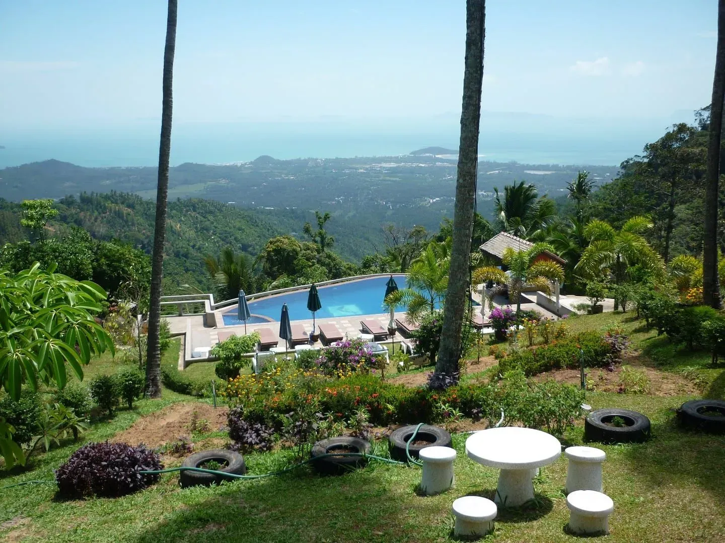 Elevated hillside view over Koh Samui's coastline and resorts, showing the island as travelers plan their booking timeline