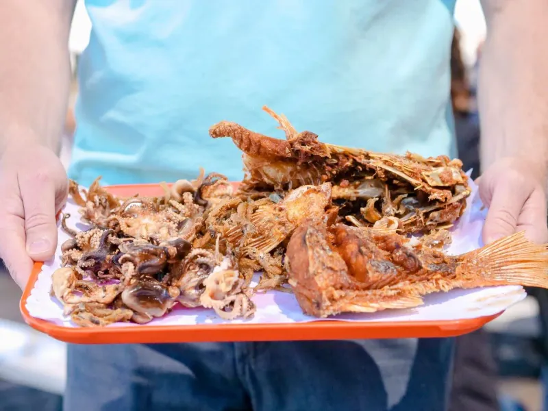 Plate of grilled fish and octopus served fresh at a Koh Samui seafood stall