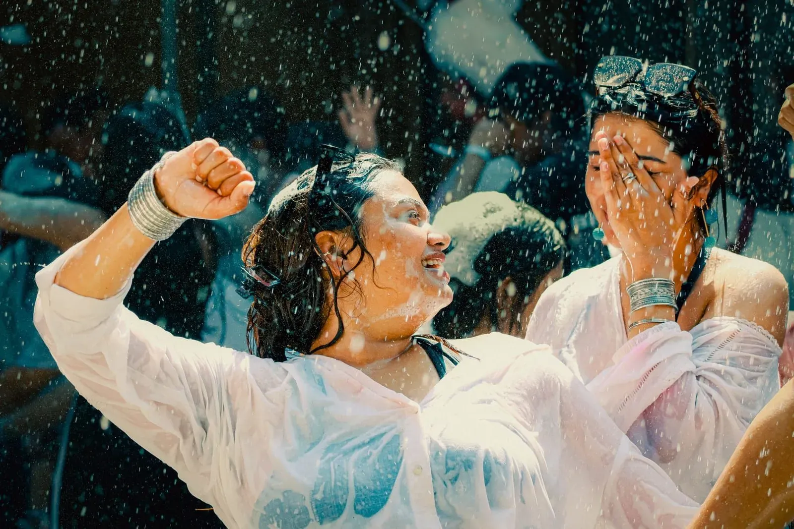 People laughing and celebrating during a street water fight, the scene that fills Chaweng during Songkran