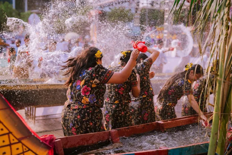 Colorful Songkran water festival celebrations during Thai New Year on Koh Samui