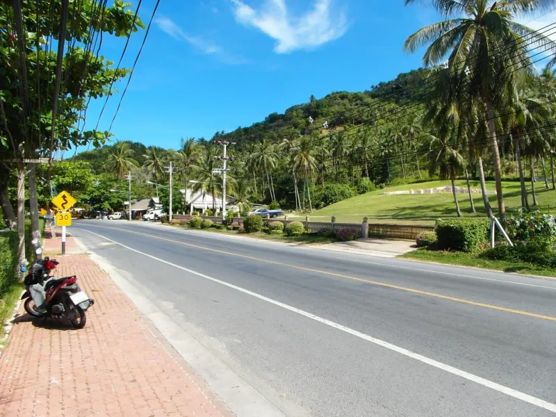 Scenic coastal view of Koh Samui with mild surf along the shoreline