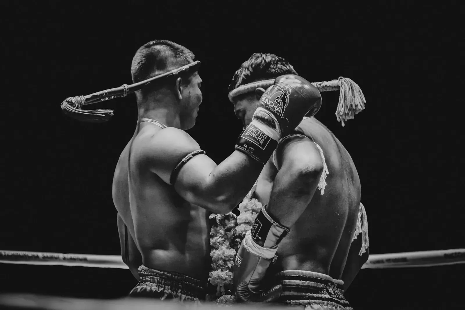 Muay Thai fighters competing under stadium lights during a fight card in Chaweng, Koh Samui