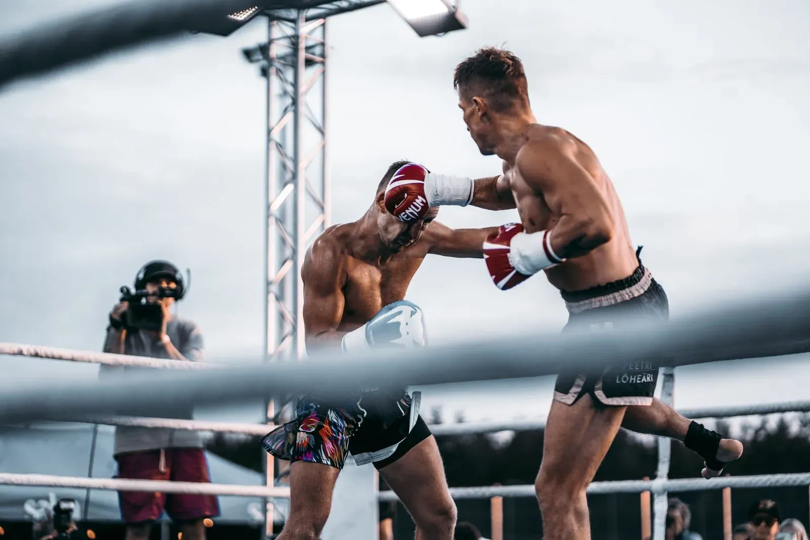 Muay Thai fighter landing a strike during a bout at a Koh Samui stadium fight night