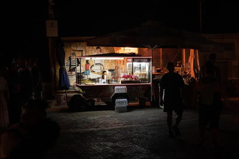 Street food stand lit up at night at a Koh Samui walking street market