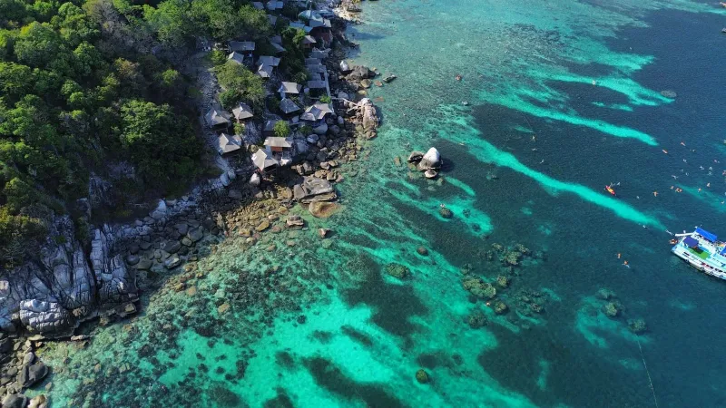 Turquoise water and rocky coastline near Choeng Mon Koh Samui resort area