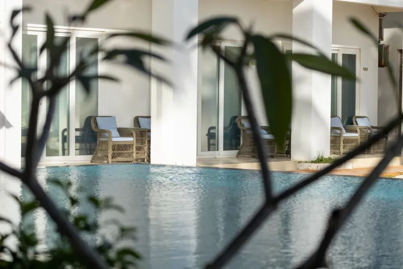 Rattan chairs beside a swimming pool at a Koh Samui hotel