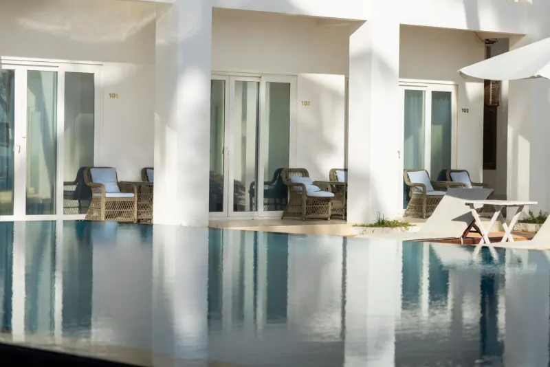 Minimalist hotel poolside seating typical of a Koh Samui mid range hotel
