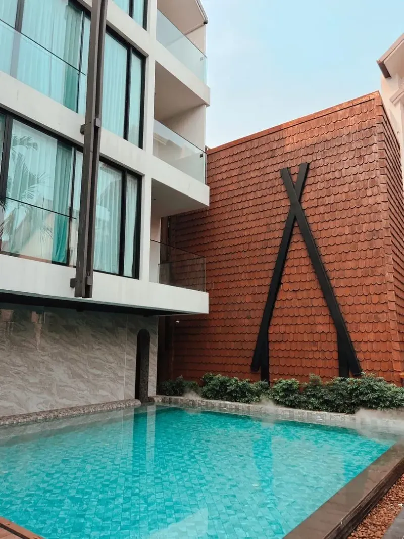 Modern three star hotel exterior with pool typical of Koh Samui mid range hotels