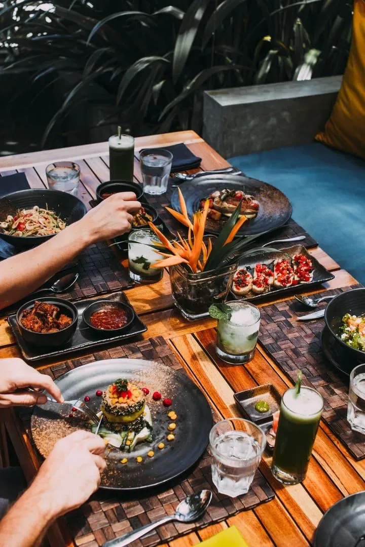 Luxurious outdoor dining spread with summer dishes at a Koh Samui beach restaurant