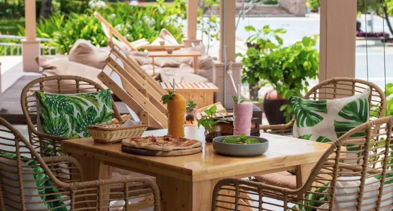 Tropical outdoor dining setup with refreshments at a Koh Samui restaurant