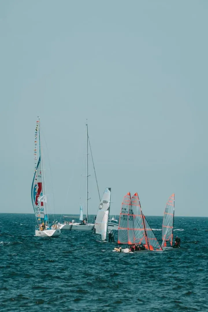Sailing vessels moored near shore, evoking the race village atmosphere of Samui Regatta week