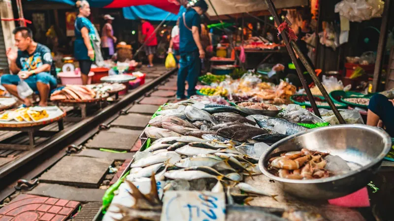Fresh fish laid out at a bustling southern Thai seafood market stall
