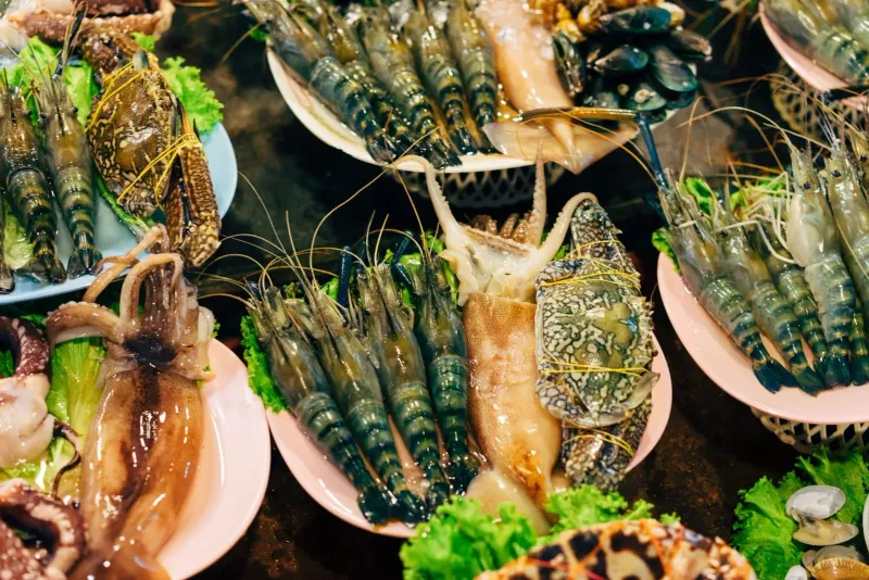 Assorted fresh shellfish and prawns on display at a Koh Samui seafood restaurant