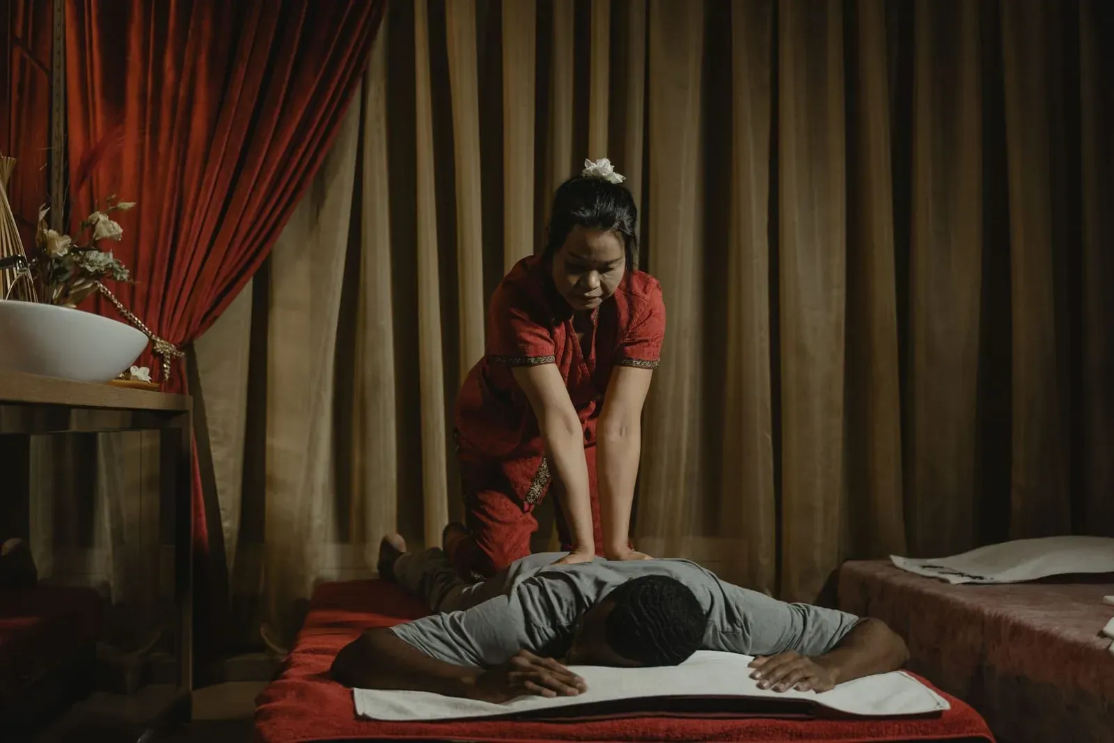 Two massage beds set up side by side in a covered Koh Samui spa treatment room