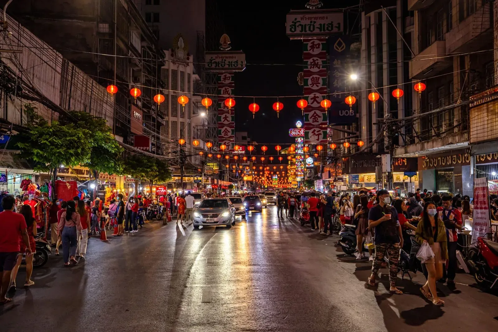 Street lined with lanterns and food vendors at night, typical of Koh Samui's late-night eating options