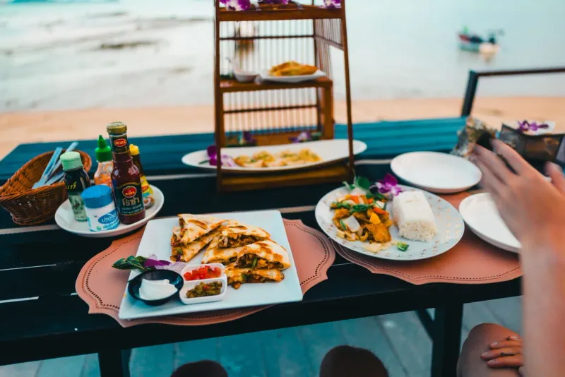 Thai meal served ocean-side with a view of the coast