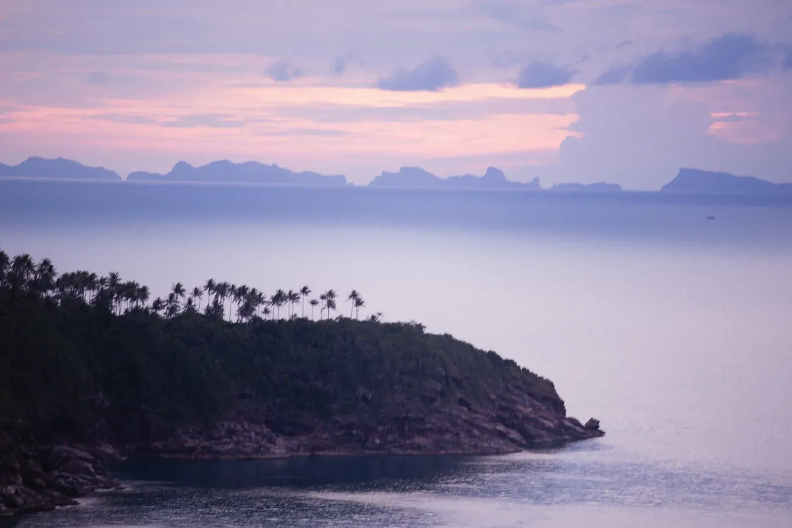 Purple sunset sky over Gulf of Thailand islands seen from a Koh Samui hillside viewpoint