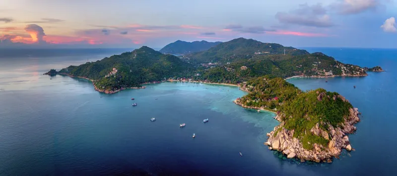Aerial coastline view at sunset representative of Koh Samui's calmer accommodation areas