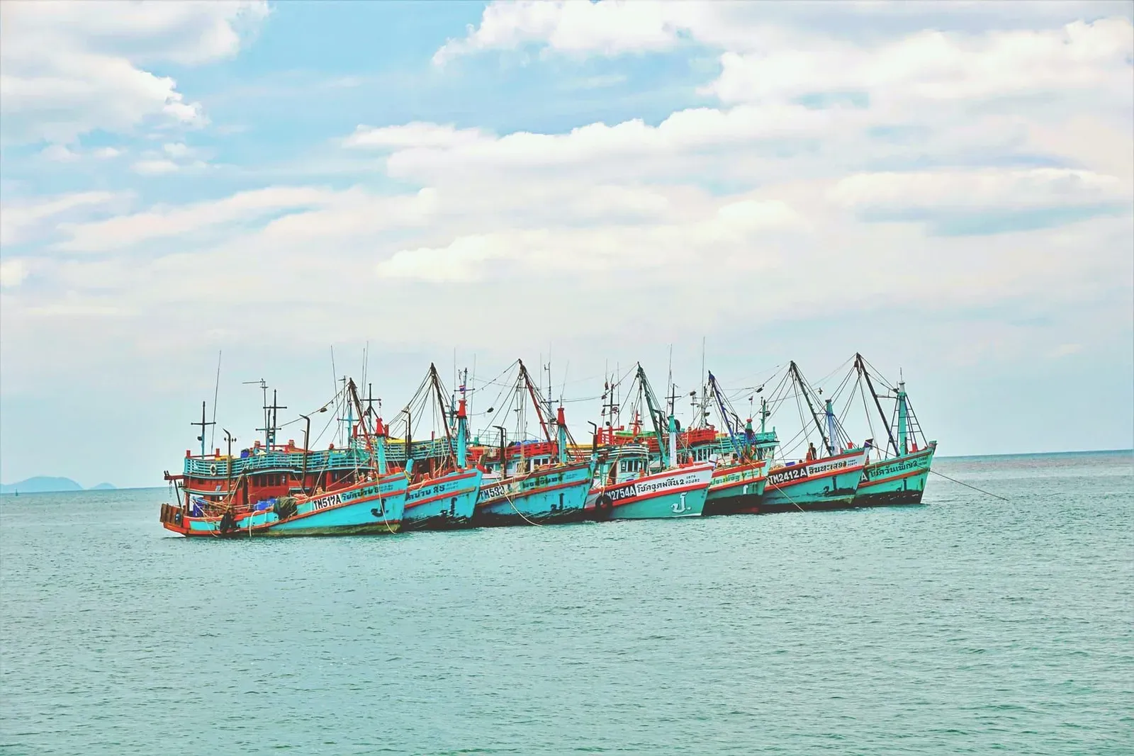 Colorful fishing boats moored near Bophut Fisherman's Village on Koh Samui's Gulf of Thailand coast
