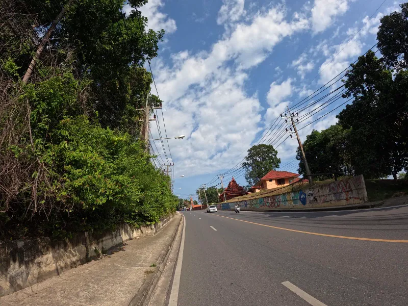 Roadside stalls and a thatched shelter along the coast road near Hua Thanon and Wat Sila Ngu, close to Krua Chao Baan restaurant, Koh Samui